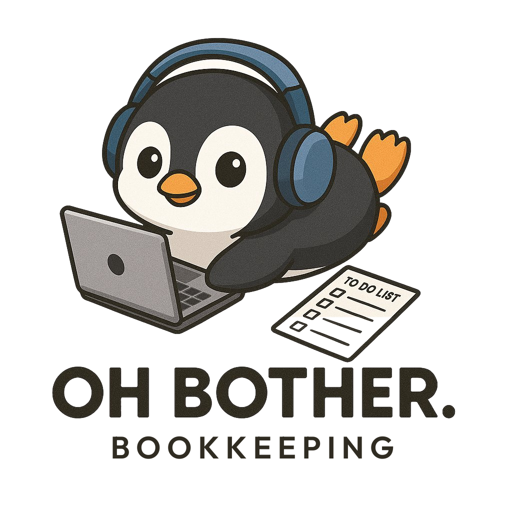 Finn the Oh Bother penguin mascot at a laptop